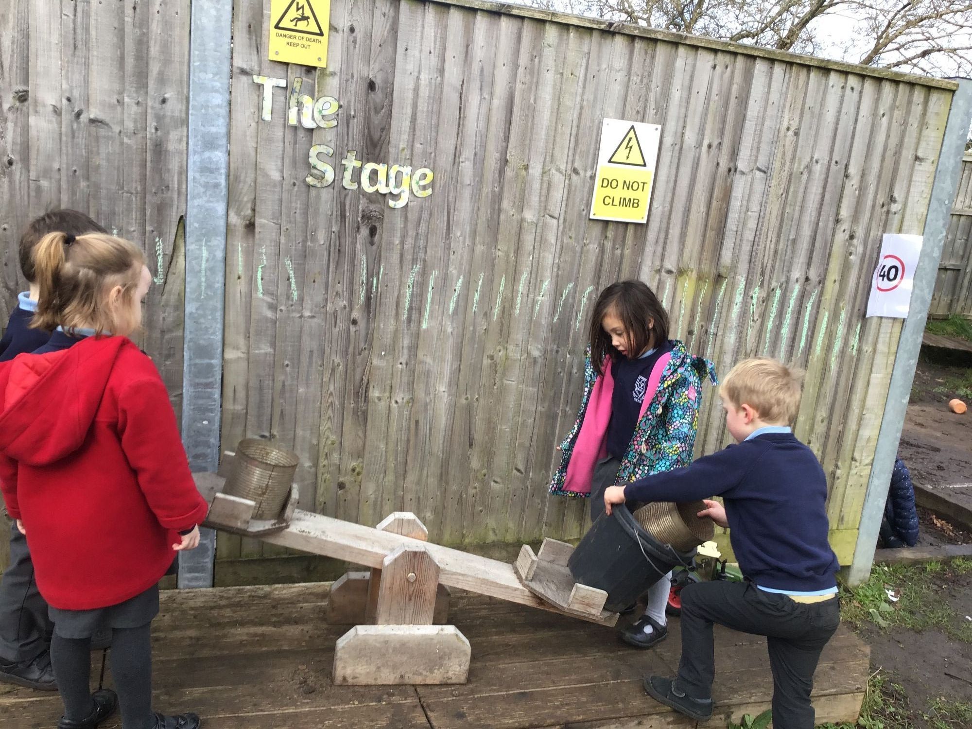 Children on see saw photo