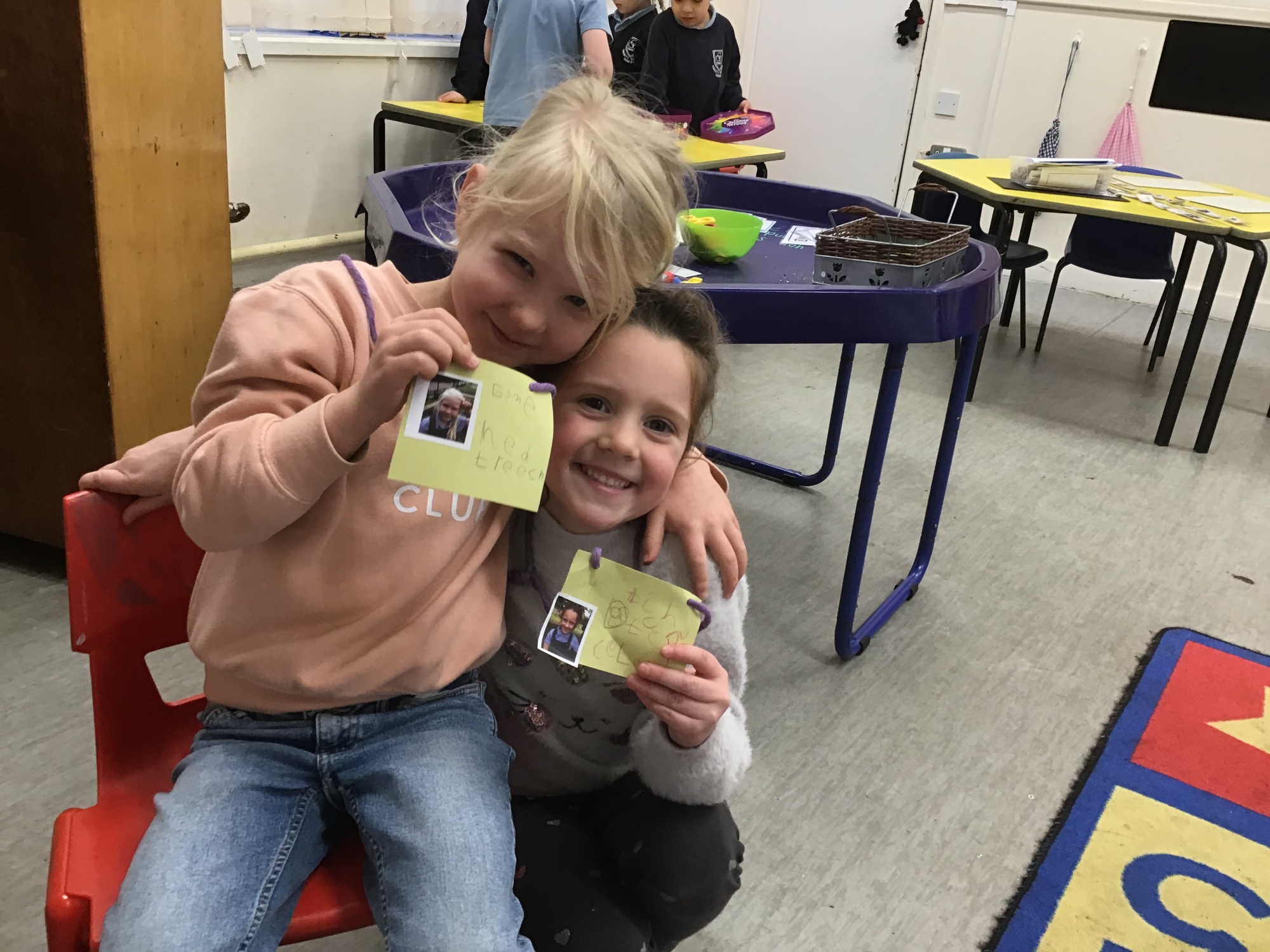 Girls making ID badges photo